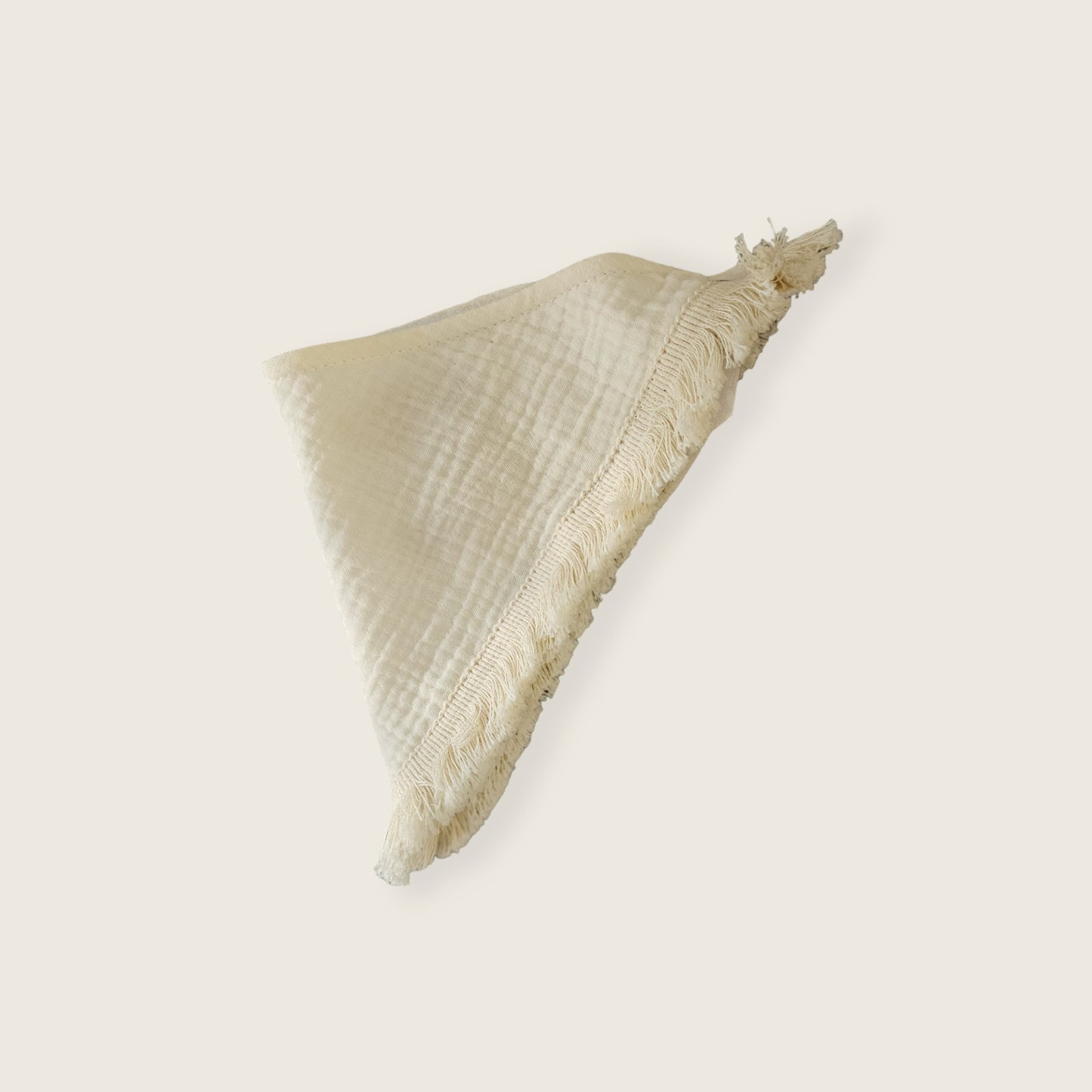 Babero muselina color crudo con barbas