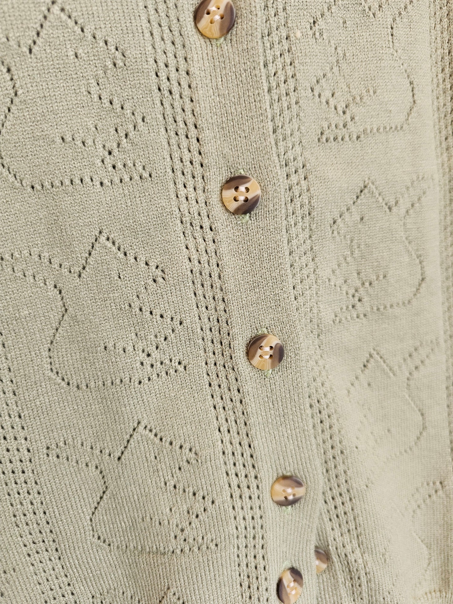 Mameluco de punto verde estampado animal