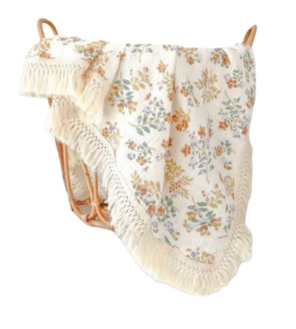 Manta estampada con flecos